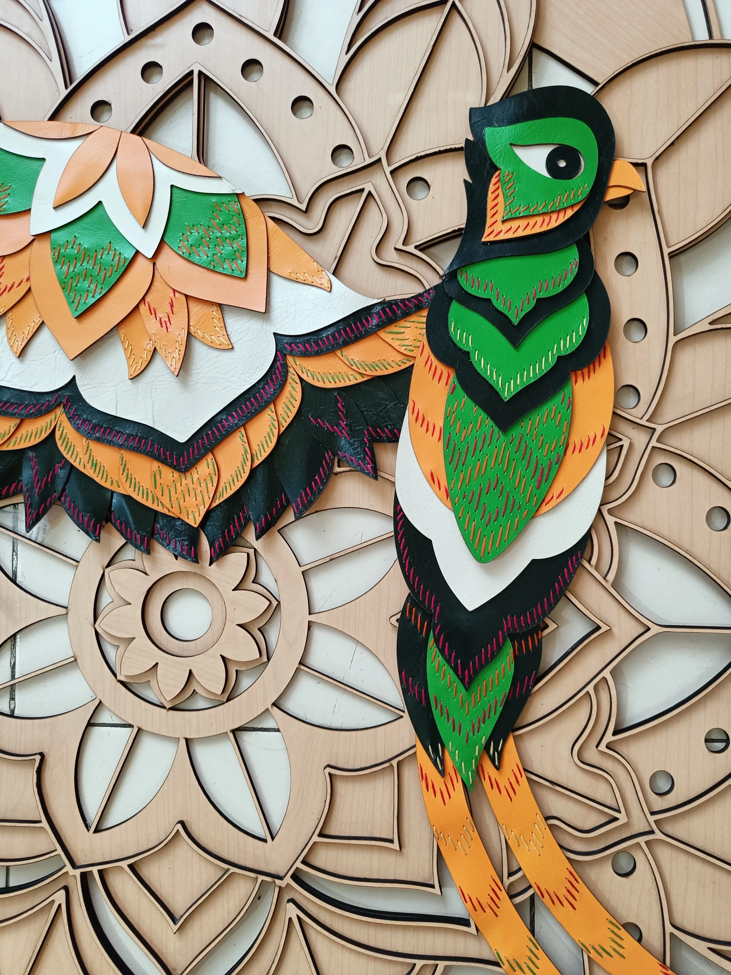 Detail of the carved mandala wood panel at Starbucks Model Town, Jalandhar
